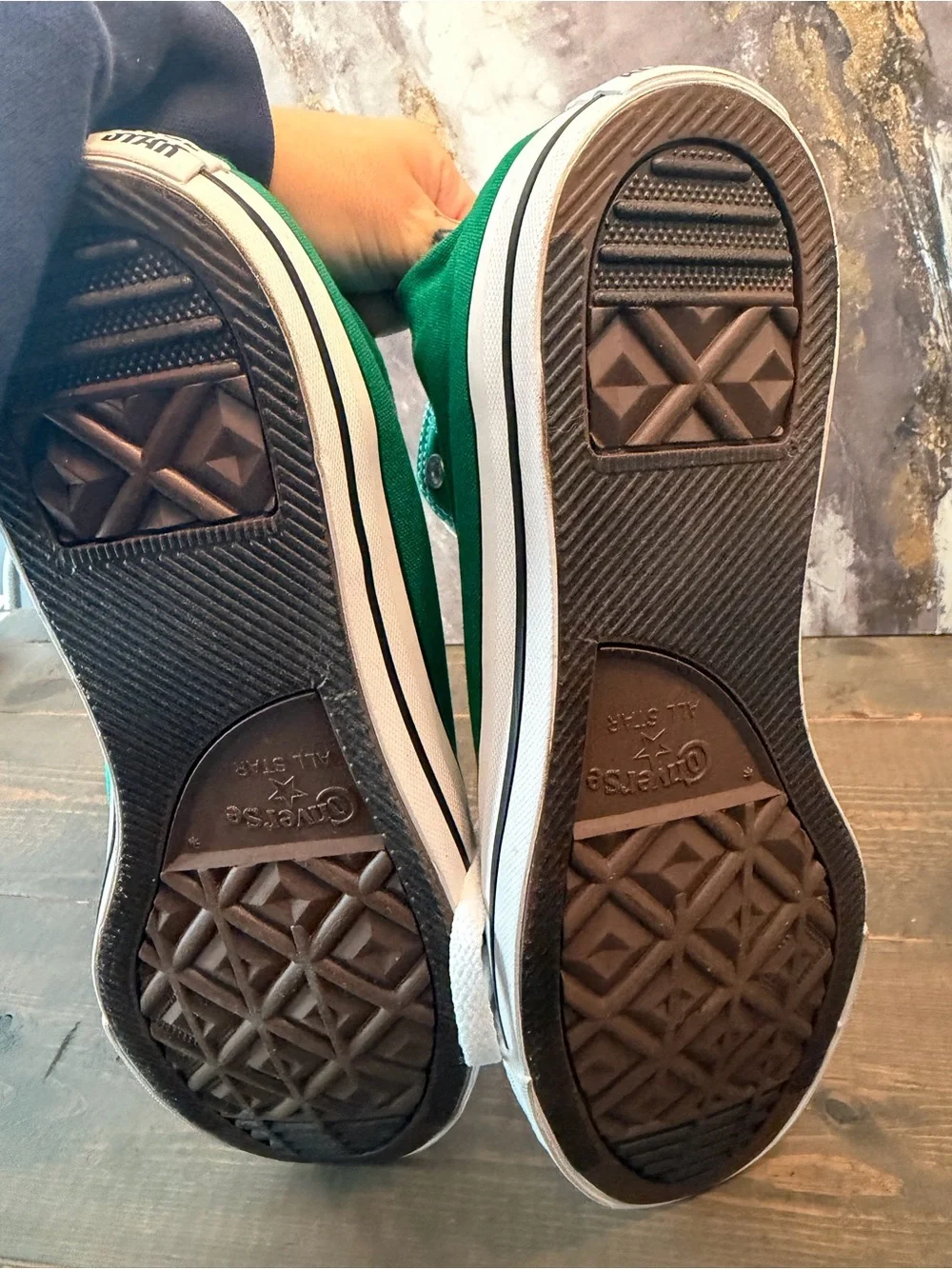 Converse Chuck Taylor All Star High Tops in “Amazon Green / White / White.”